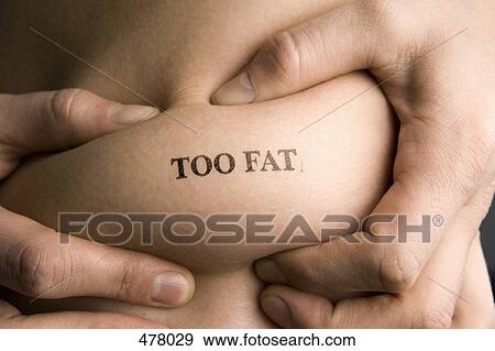 Stock Photo - A man pinching part of his abdomen stamped 'Too Fat'. Fotosearch