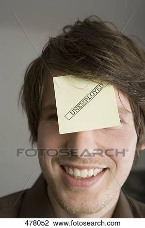A man with an adhesive note on his forehead stamped 'Unemployed' View Large Photo Image Stock Image - A man with an adhesive note on his forehead stamped 'Unemployed'. Fotosearch