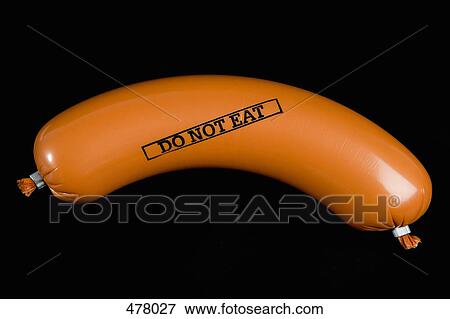 A sausage wrapped in plastic packaging and stamped 'Do Not Eat' View Large Photo Image Stock Photo - A sausage wrapped in plastic packaging and stamped 'Do Not Eat'. Fotosearch