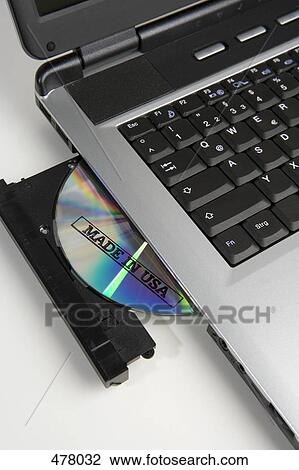 CD stamped 'Made in USA' in the disc drive of a laptop computer View Large Photo Image Stock Image - CD stamped 'Made in USA' in the disc drive of a laptop computer. Fotosearch