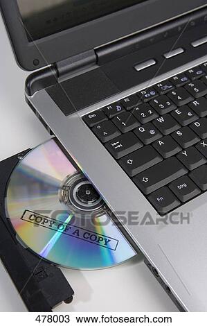 Copied CD in the disc drive of a laptop computer View Large Photo Image Stock Image - Copied CD in the disc drive of a laptop computer. Fotosearch