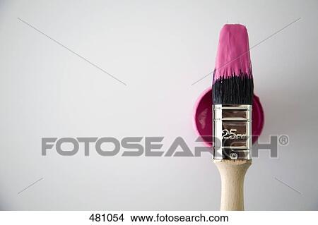 A paintbrush on top of a paint tin View Large Photo Image Picture - A paintbrush on top of a paint tin. Fotosearch