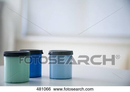 Paint tins on a table View Large Photo Image Stock Photograph - Paint tins on a table. Fotosearch