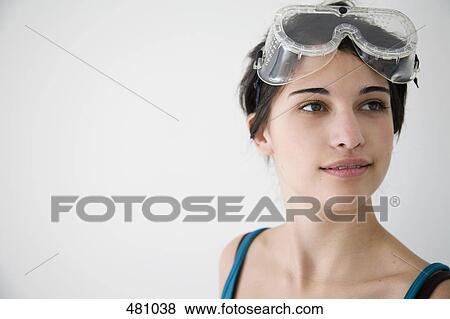 Teenage girl wearing protective glasses View Large Photo Image Stock Photo - Teenage girl wearing protective glasses. Fotosearch