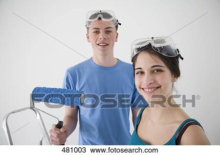 Two teenagers decorating View Large Photo Image Stock Image - Two teenagers decorating. Fotosearch