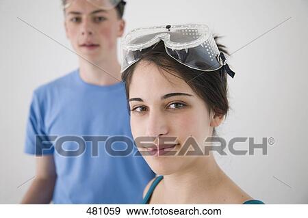Two teenagers wearing safety glasses View Large Photo Image Stock Photo - Two teenagers wearing safety glasses. Fotosearch