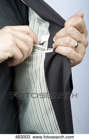 A businessman reaching for money in his suit pocket View Large Photo Image Stock Image - A businessman reaching for money in his suit pocket. Fotosearch