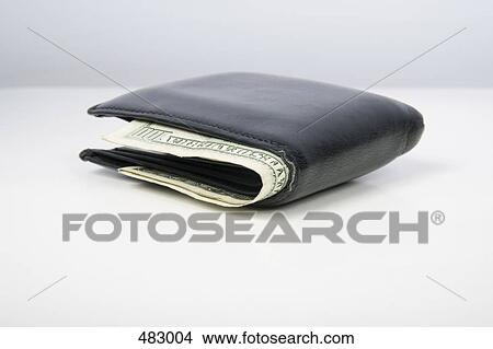 A leather wallet with US bank notes poking out View Large Photo Image Picture - A leather wallet with US bank notes poking out. Fotosearch