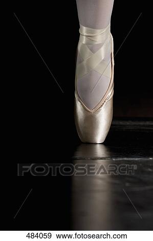 Stock Photo - A ballerina balancing on tiptoe. Fotosearch
