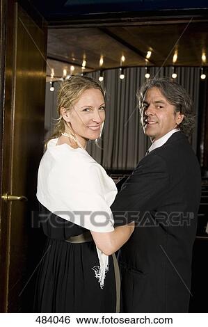 A couple entering a theater View Large Photo Image Stock Photograph - A couple entering a theater. Fotosearch