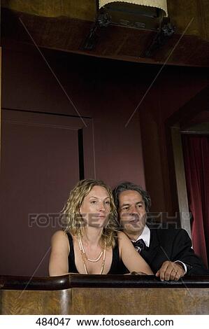 A couple sitting together in a theater box View Large Photo Image Stock Photo - A couple sitting together in a theater box. Fotosearch