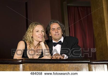 Stock Photo - A couple sitting together in a theater box. Fotosearch