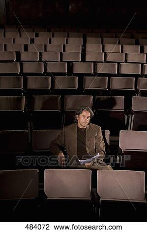 A director sitting in a theater View Large Photo Image Stock Image - A director sitting in a theater. Fotosearch