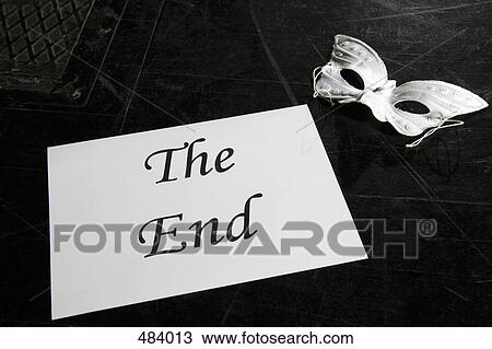 A mask and a sign for 'The End' on a theater stage View Large Photo Image Stock Image - A mask and a sign for 'The End' on a theater stage. Fotosearch