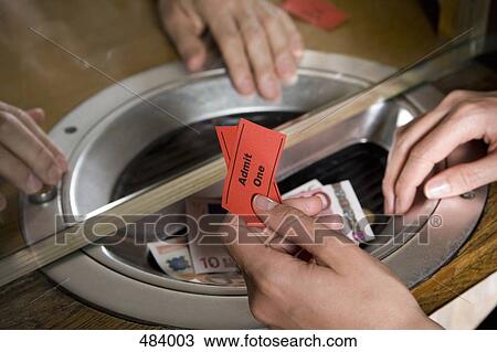 A person buying tickets at a box office View Large Photo Image Stock Image - A person buying tickets at a box office. Fotosearch