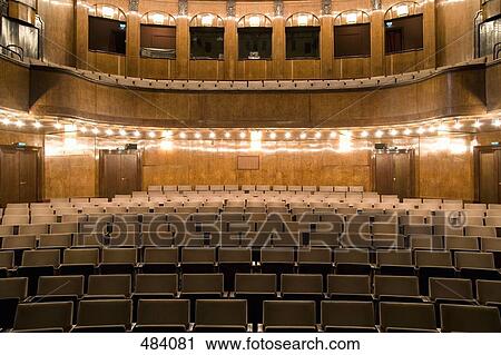 Empty seating in an illuminated art deco theater View Large Photo Image Stock Image - Empty seating in an illuminated art deco theater. Fotosearch