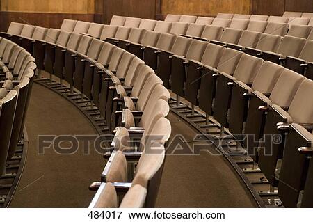 Rows of empty seating in an auditorium View Large Photo Image Stock Photo - Rows of empty seating in an auditorium. Fotosearch