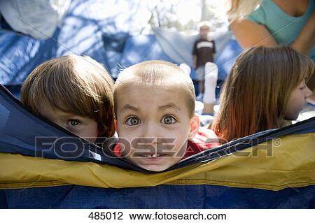 Stock Image - A group of children in a tent. Fotosearch