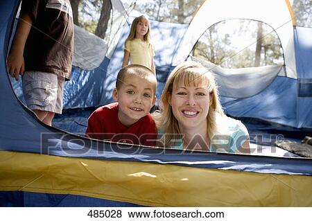 Stock Photo - Portrait of a mother and son in a tent. Fotosearch