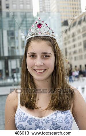 A portrait of an adolescent girl wearing a tiara View Large Photo Image Stock Image - A portrait of an adolescent girl wearing a tiara. Fotosearch