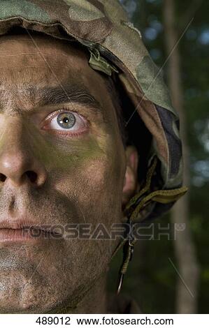 Portrait of a soldier wearing camouflage face paint View Large Photo Image Stock Image - Portrait of a soldier wearing camouflage face paint. Fotosearch