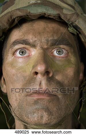 Portrait of a soldier wearing camouflage face paint View Large Photo Image Stock Photography - Portrait of a soldier wearing camouflage face paint. Fotosearch