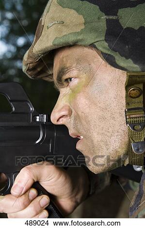 Soldier aiming his gun View Large Photo Image Picture - Soldier aiming his gun. Fotosearch