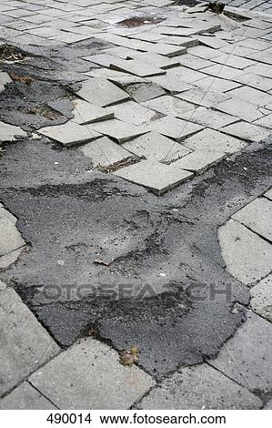 A ruptured pavement View Large Photo Image Picture - A ruptured pavement. Fotosearch
