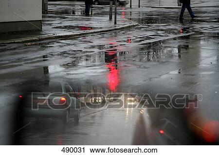 Stock Image - A street scene in the rain. Fotosearch