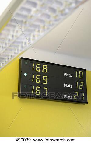 An electric number display in a waiting room View Large Photo Image Stock Photo - An electric number display in a waiting room. Fotosearch
