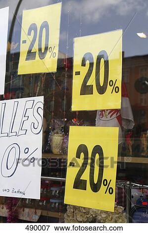 Stock Photo - Sale signs in a store window. Fotosearch