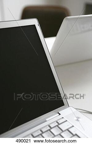 Stock Image - Two laptop computer's on a desk. Fotosearch
