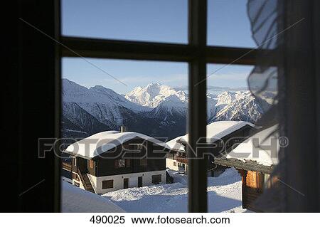 View through a window of a ski resort View Large Photo Image Stock Photography - View through a window of a ski resort. Fotosearch