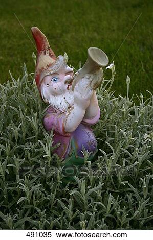 A ceramic gnome in a garden View Large Photo Image Stock Photography - A ceramic gnome in a garden. Fotosearch