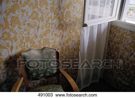 A chair beside an open window View Large Photo Image Stock Image - A chair beside an open window. Fotosearch