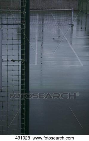 Stock Photo - Detail of a wet tennis court. Fotosearch