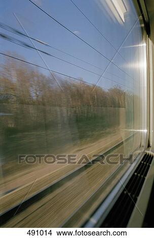 Picture - View through the window of a passenger train. Fotosearch