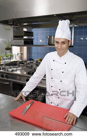 A chef in a commercial kitchen View Large Photo Image Stock Photo - A chef in a commercial kitchen. Fotosearch