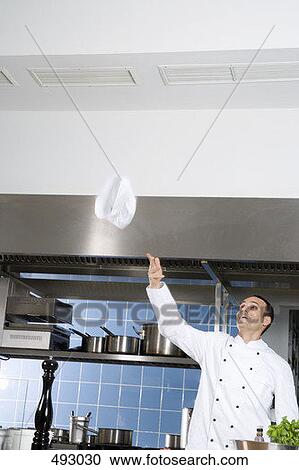 A chef throwing his hat into the air View Large Photo Image Stock Image - A chef throwing his hat into the air. Fotosearch