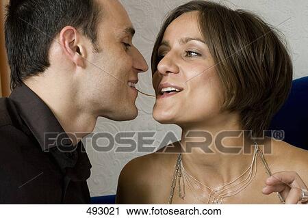 A couple eating the same piece of spaghetti View Large Photo Image Stock Image - A couple eating the same piece of spaghetti. Fotosearch