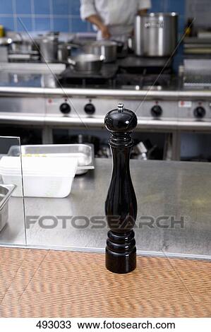 A pepper mill on a kitchen counter View Large Photo Image Stock Image - A pepper mill on a kitchen counter. Fotosearch