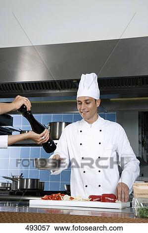 Chefs working in a kitchen View Large Photo Image Stock Photo - Chefs working in a kitchen. Fotosearch