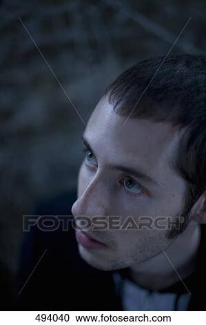 A young man looking up View Large Photo Image Stock Image - A young man looking up. Fotosearch