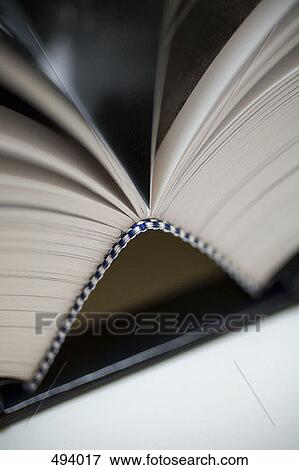 Detail of an open book View Large Photo Image Stock Photo - Detail of an open book. Fotosearch