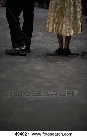 Low section of a man and a woman in formal clothing View Large Photo Image Stock Photo - Low section of a man and a woman in formal clothing. Fotosearch
