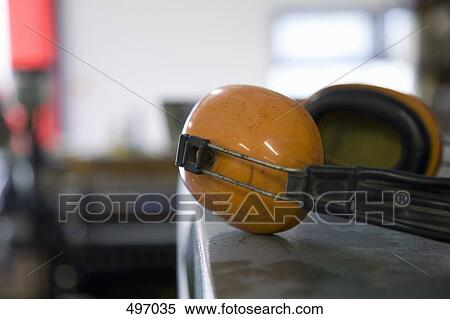 A pair of ear protectors on a machine View Large Photo Image Stock Photography - A pair of ear protectors on a machine. Fotosearch
