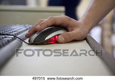 Stock Photography - Detail of a man using a computer mouse. Fotosearch