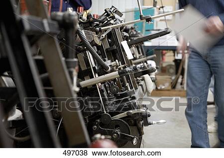 Stock Photo - Detail of manufacturing equipment at a printing press. Fotosearch