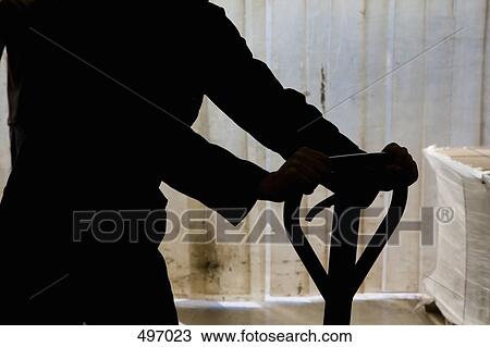 Midsection of a man using a forklift View Large Photo Image Stock Image - Midsection of a man using a forklift. Fotosearch