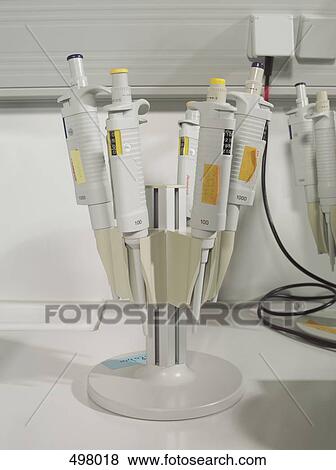 Stock Photo - A rack of pipettes in a laboratory. Fotosearch